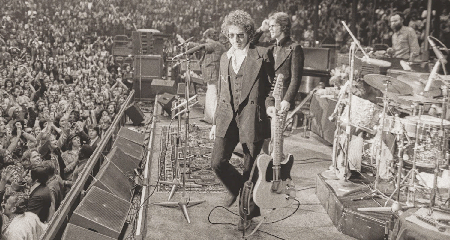 Bob Dylan and The Band on stage at Chicago Stadium during their 1974 tour. Photo by Barry Feinstein