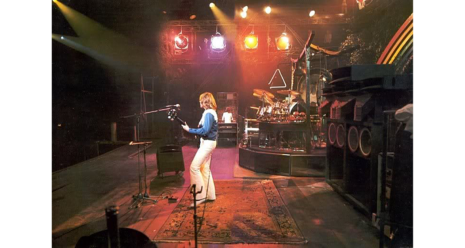 Greg Lake plays with Persian rug on stage