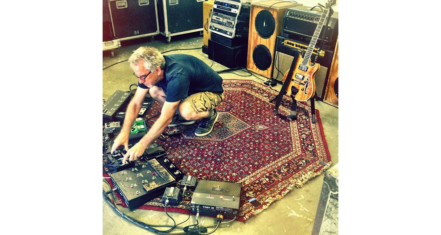 Rugs and Rockers: The Strange Bond Between Persian Rugs and Rock’n’Roll 12 Guitar technician Brian Brown adjusting Trey Anastasio’s pedalboard setup atop an Tabriz octagonal Persian rug during a tour soundcheck (c. 2013).