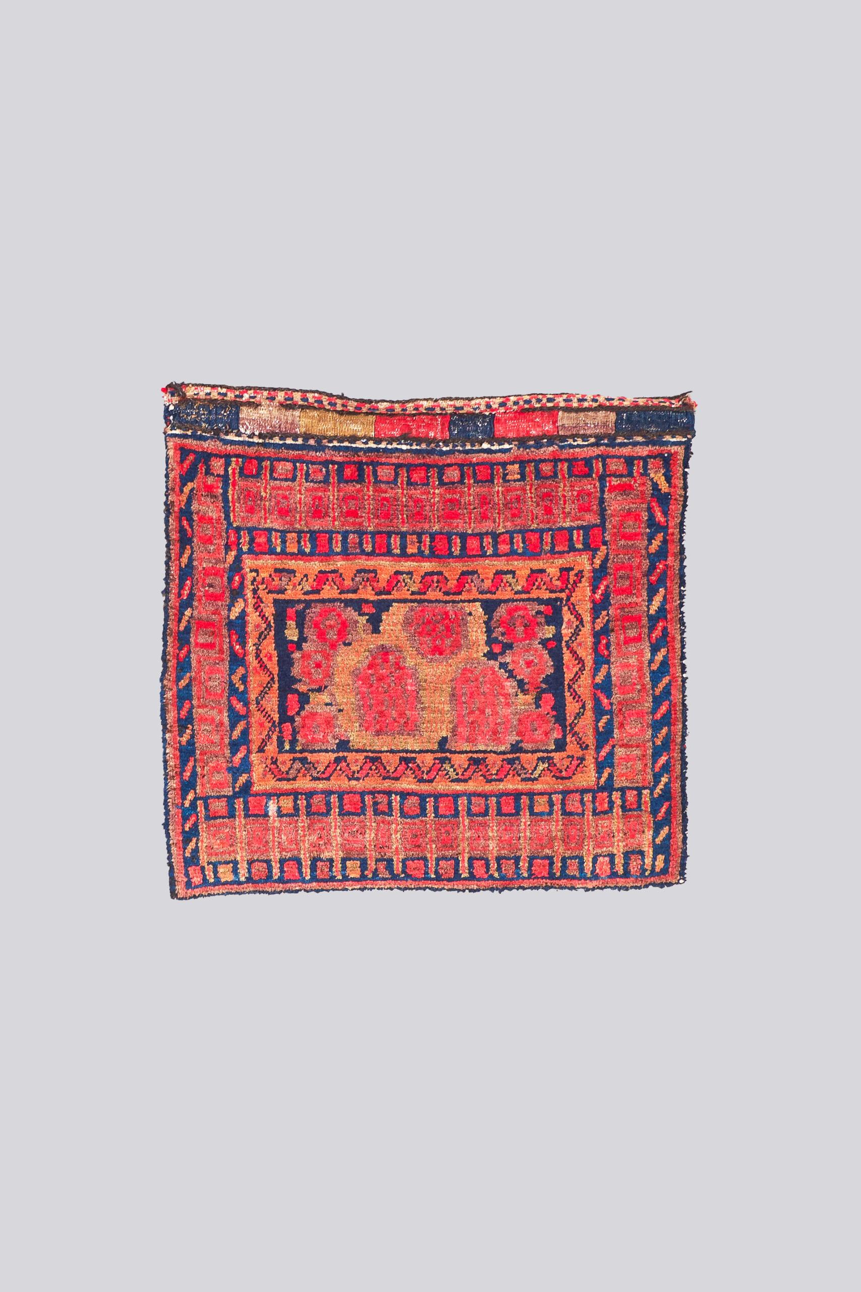 Pair of antique Golfarang Persian Saddlebag faces 1
